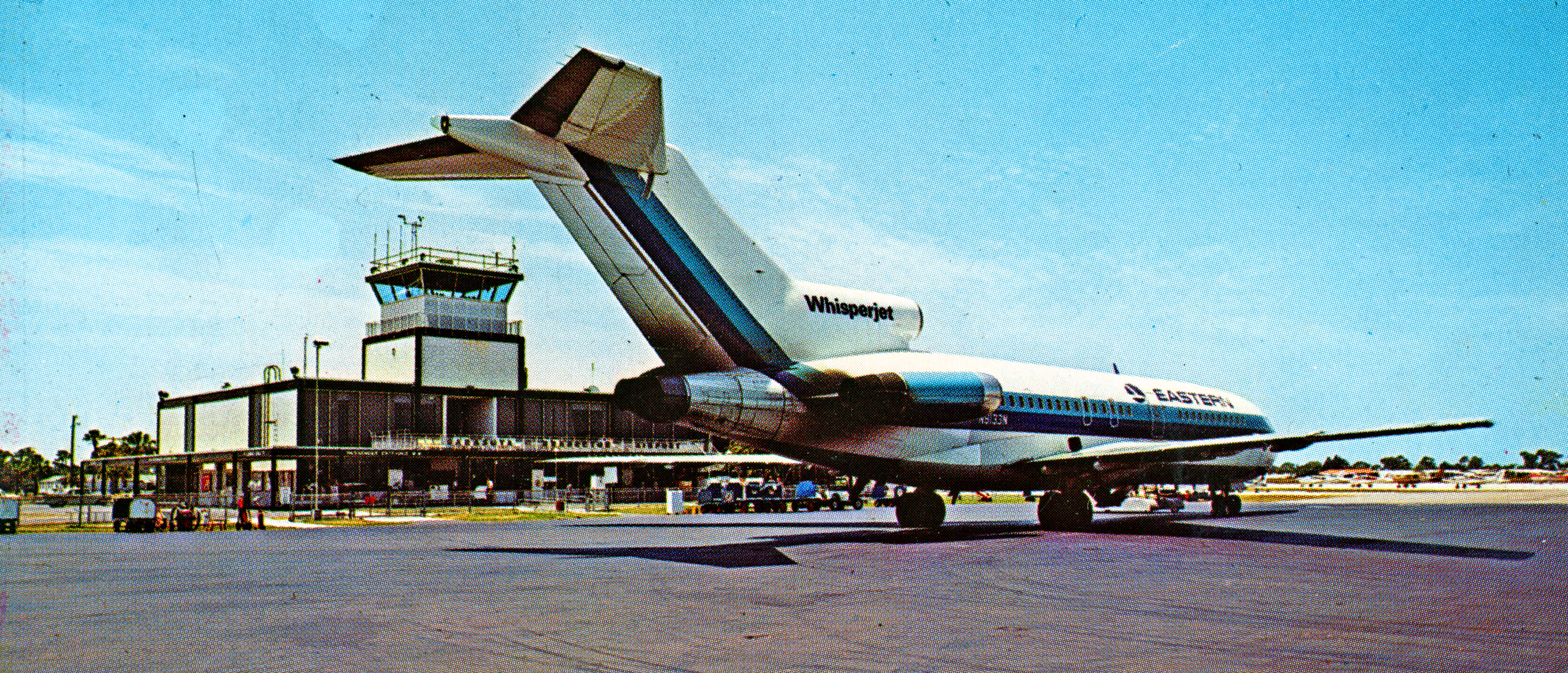 A color postcard of an airplane jet at the SRQ airport.