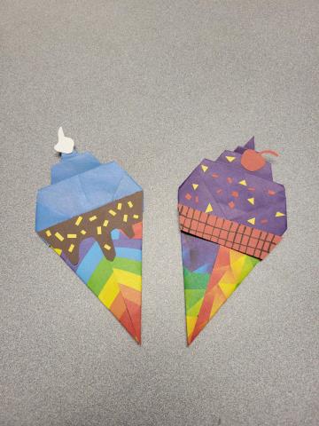 Brightly colored origami paper folded to look like ice cream cones.