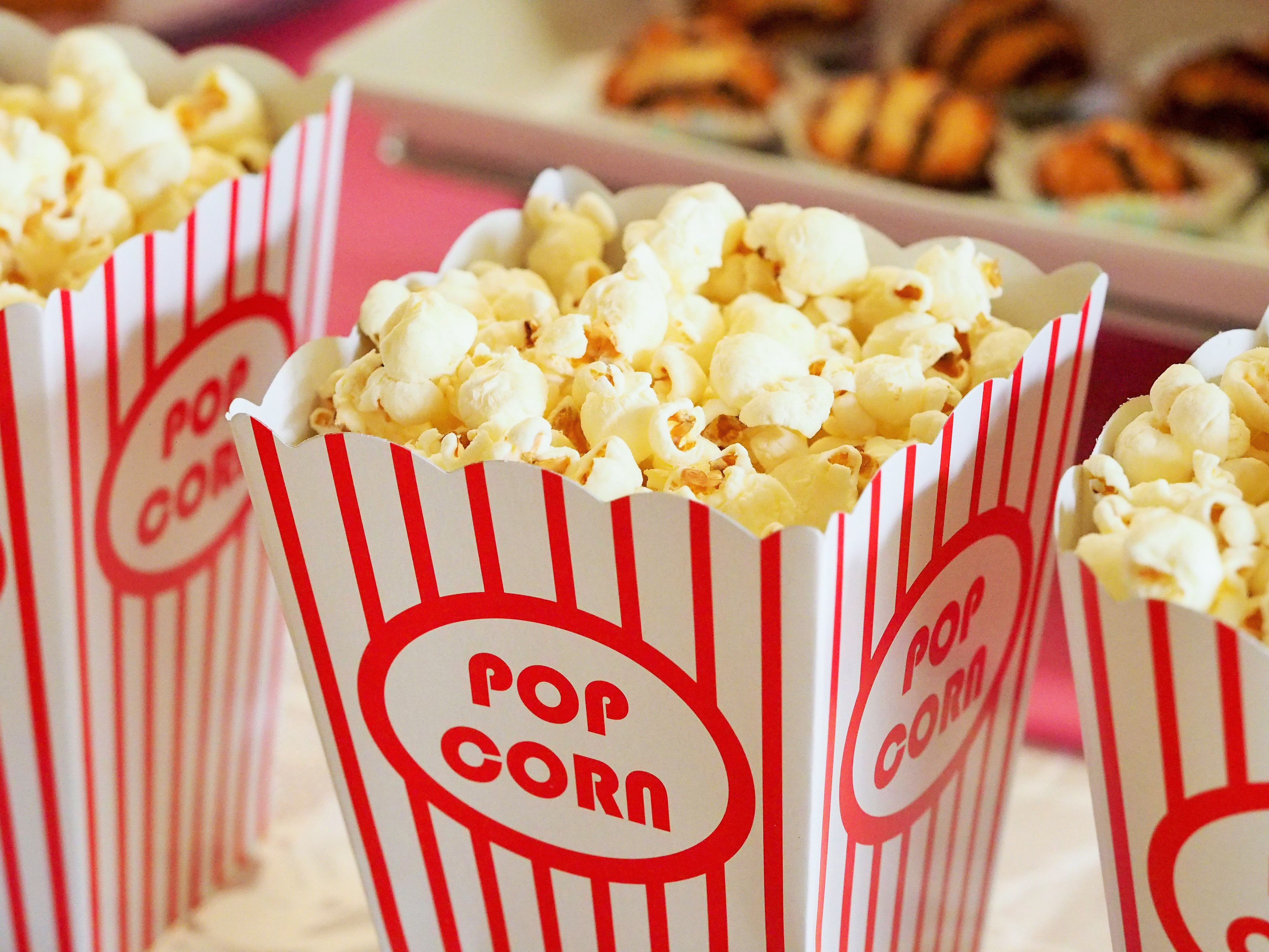 Popcorn in nostalgic red and white striped containers.
