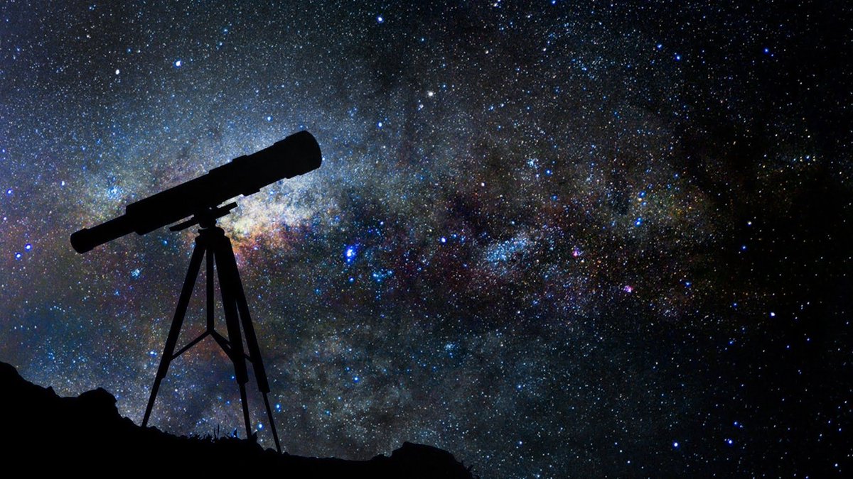 Photo of telescope and night sky
