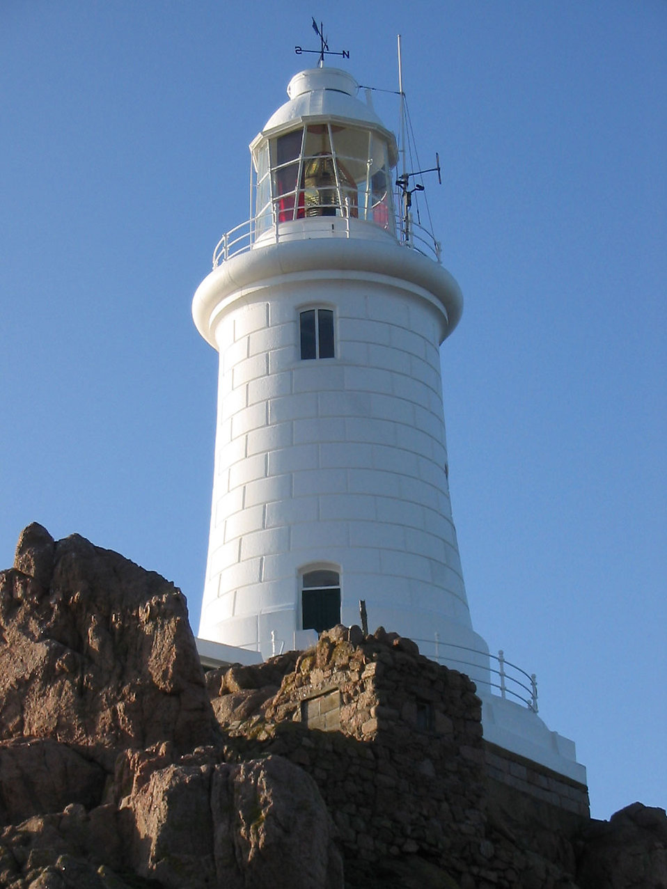 White lighthouse on rocks