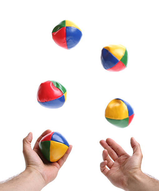 Hands juggling 5 colorful balls