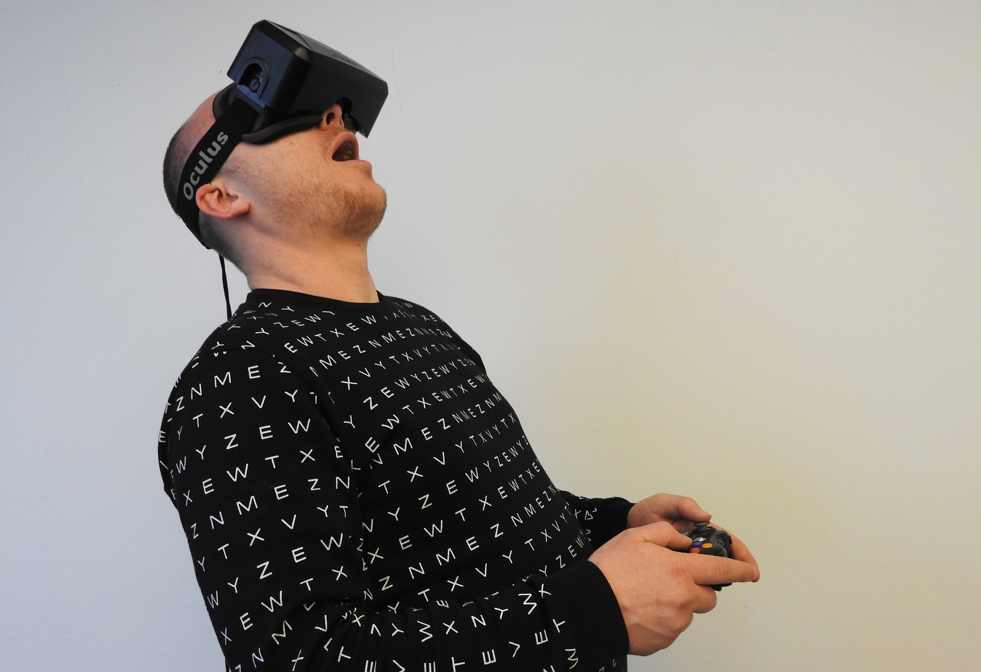 Man wearing a virtual reality headset and looking amazed.
