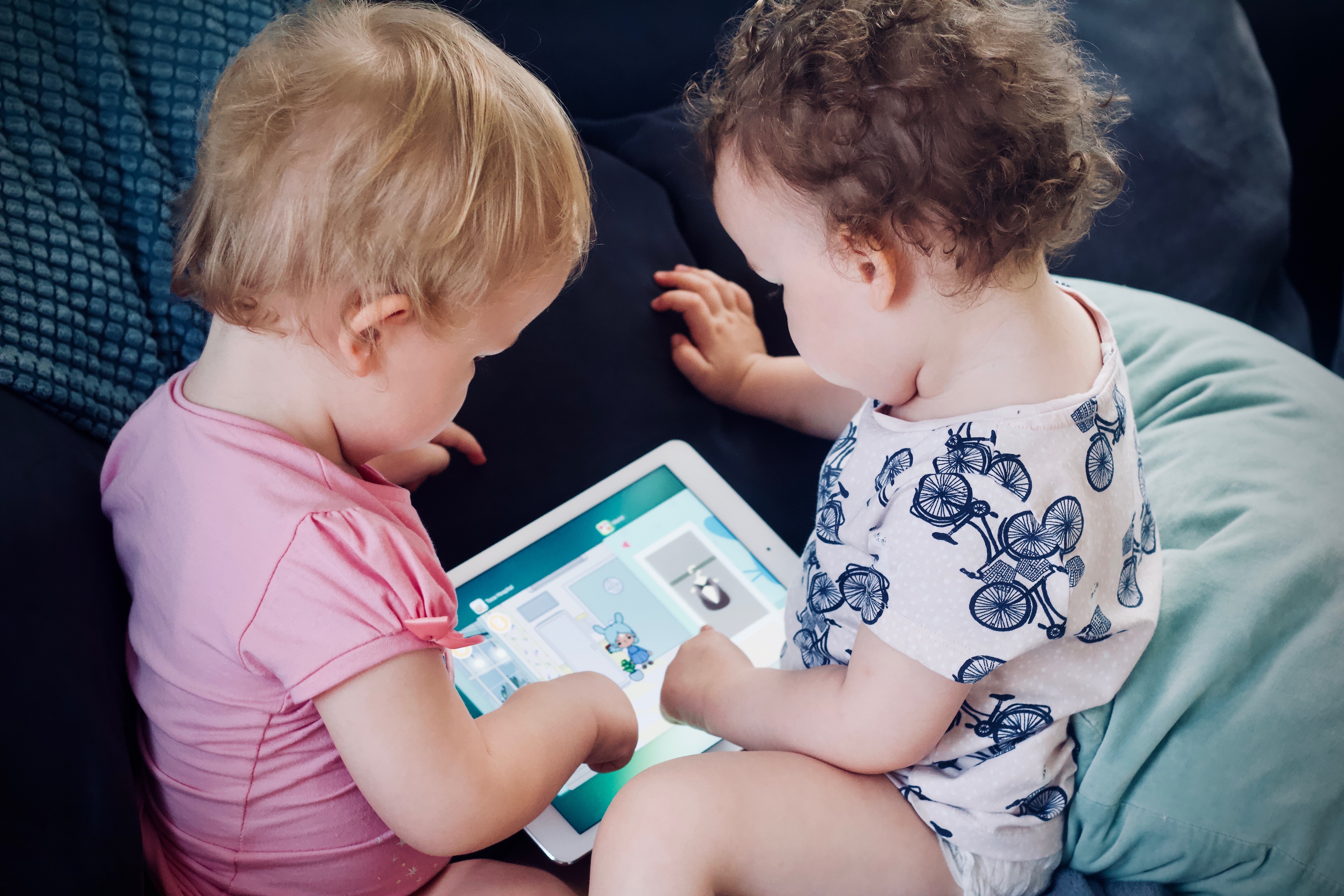 Babies playing with iPad
