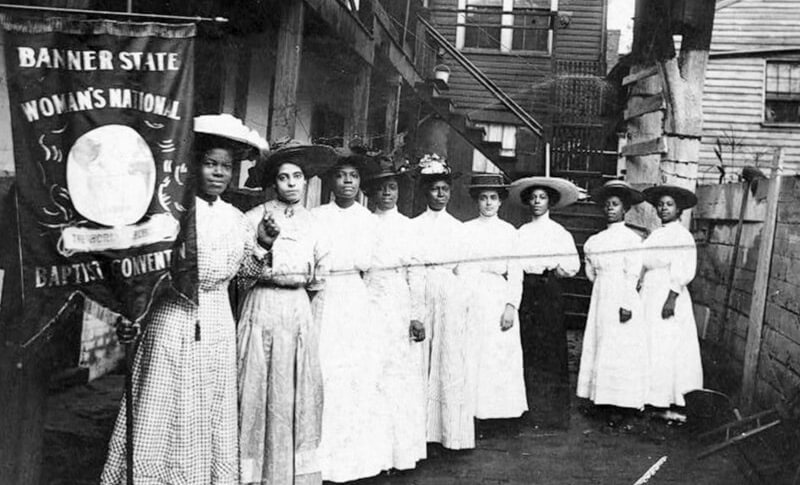 African American Suffrage women with banners and signs.