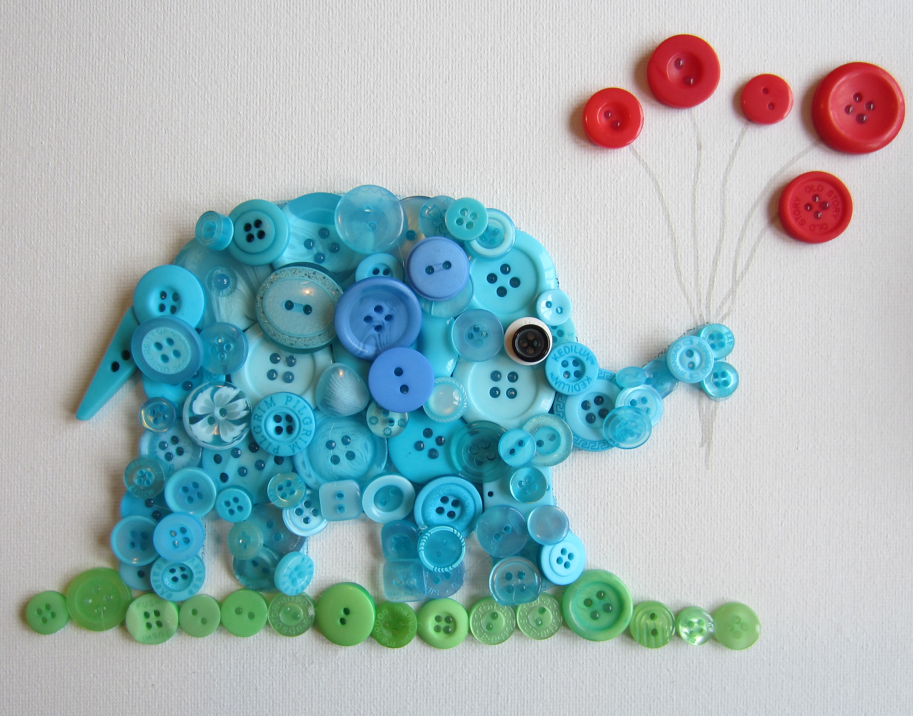 Blue elephant made out of buttons