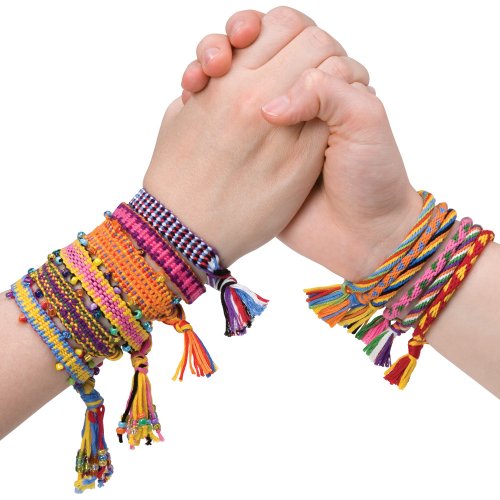 Two hands with string friendship bracelets