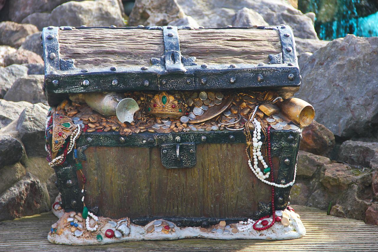 Treasure chest with gold spilling out.