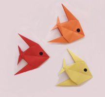 3 origami fish, 1 orange, 1 red, 1 yellow