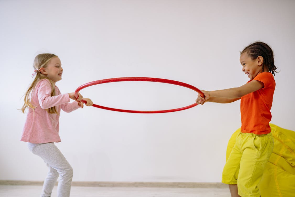 two kids and a hula hoop