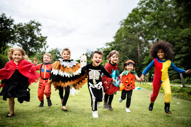 A group of children in Halloween costumes.