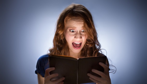 Girl screaming while reading book