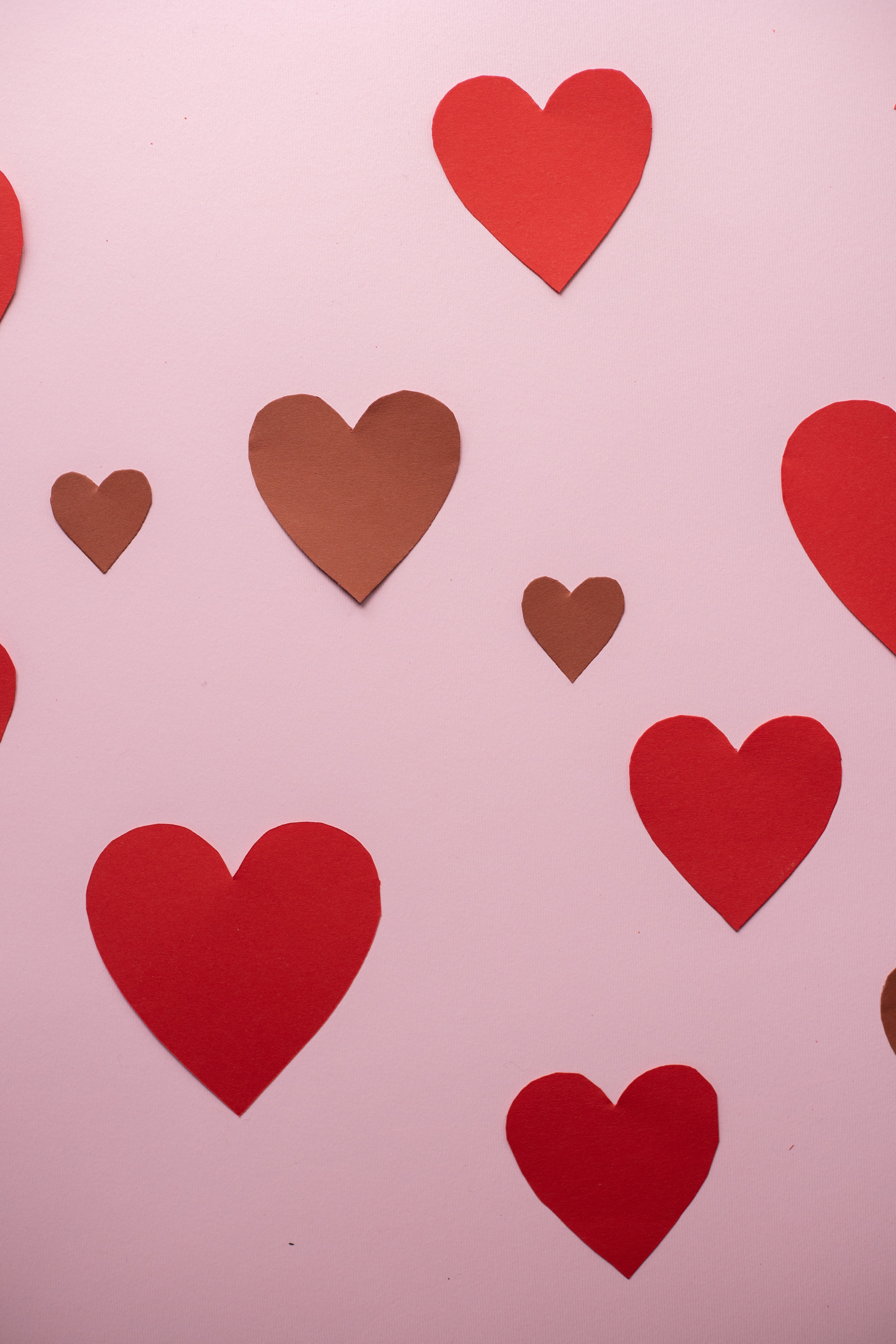 red hearts on pink background