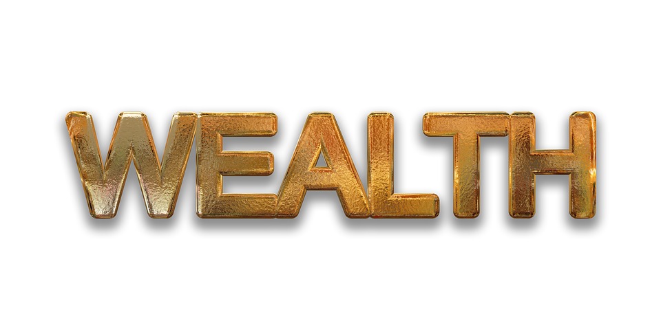 Gold letters spelling wealth