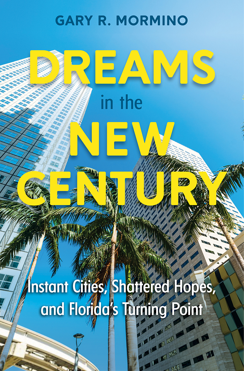 Book cover for Dreams in the New Century, featuring skyscrapers against a deep blue sky with a palm tree.
