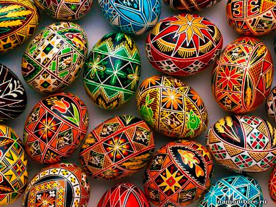 Colorful and intricate designs on wooden Ukrainian Pysanky eggs.