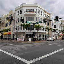 Street corner with traffic lights and hotel in background