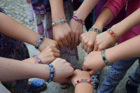 People's hands with bracelets