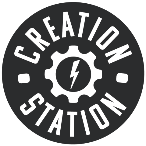 Black and white Creation Station round logo with a gear symbol containing a firebolt in the center