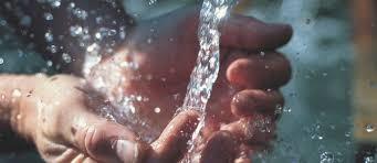 Water pouring onto hands.