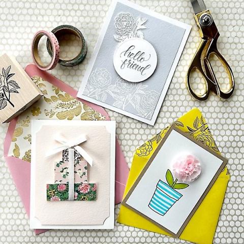 Collage of handmade greeting cards, with ribbon and scissors