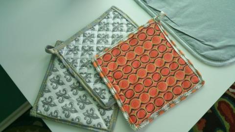 3 handmade potholders made with different fabric patterns