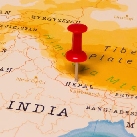 Map zoomed in on location of Nepal. Nepal is marked by a red thumbtack.