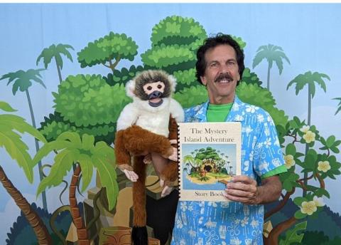 Man with a monkey puppet.