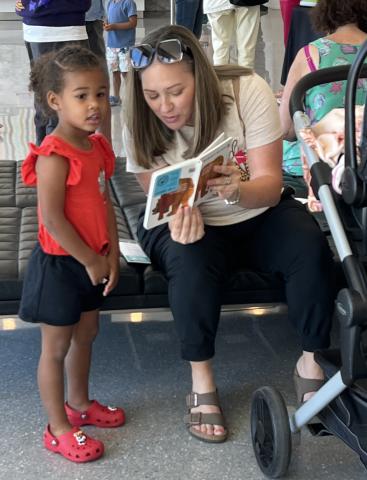 image of women reading to girl