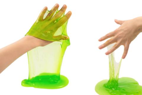 Hand covered in green slime.