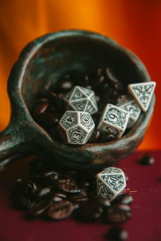 D&D dice in a handmade mug
