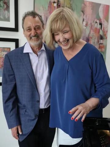 Photo of pianist Alan Wasserman and artist Midge Johnson.