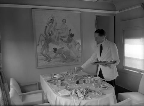 A waiter sets the table in a Sarasota restaurant. 
