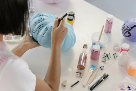 painting a pumpkin blue