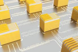 Stacks of computer file icons connected by circuits.
