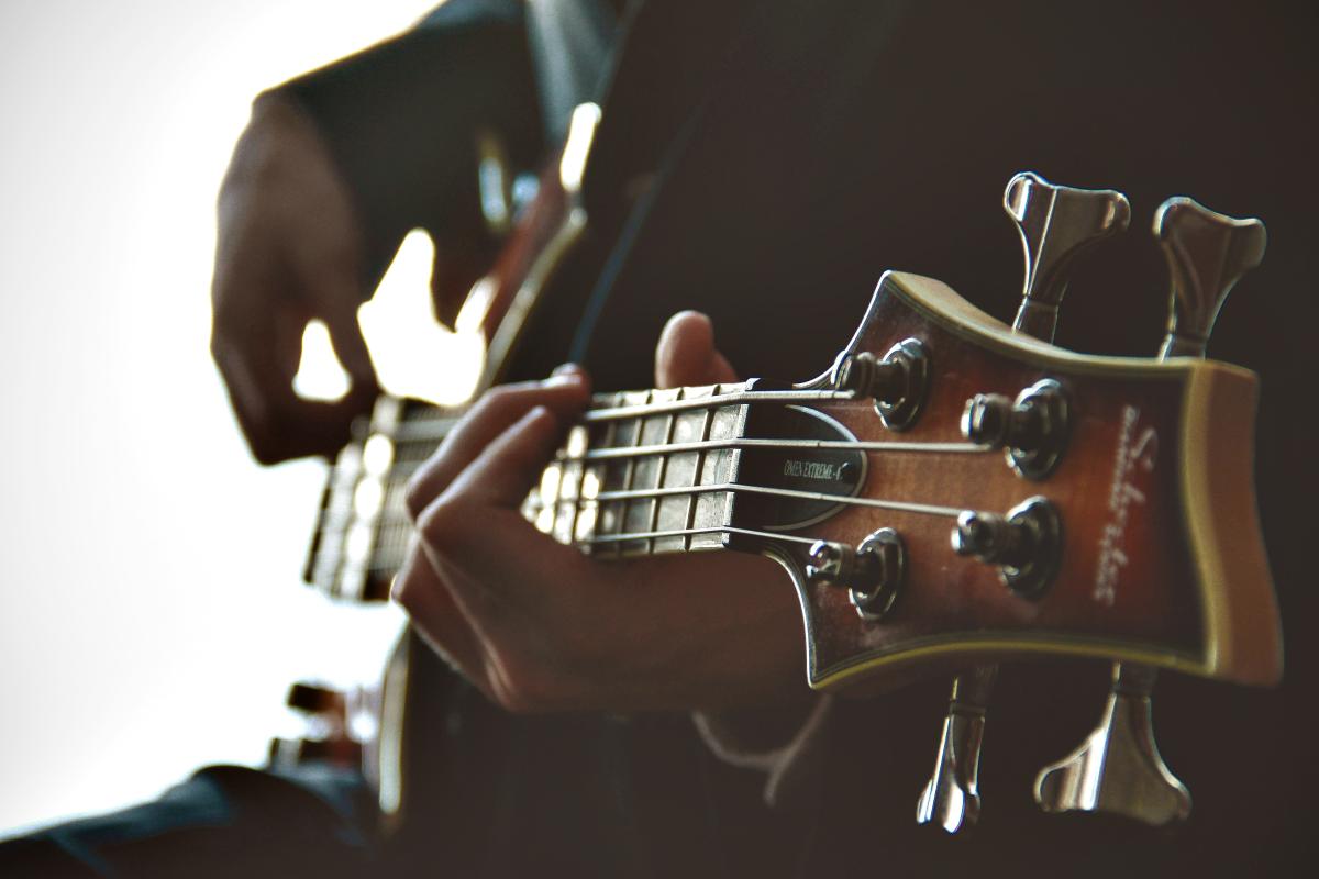 Person playing a guitar.