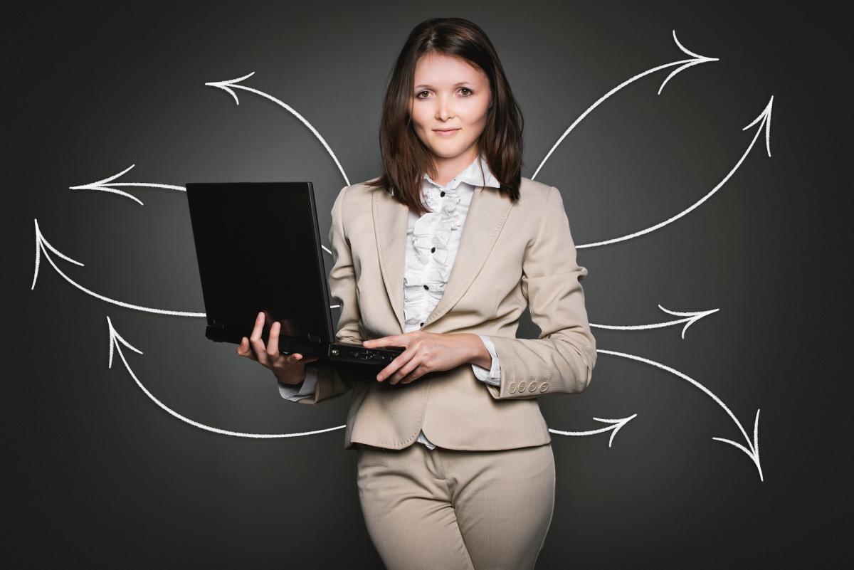 Woman holding laptop computer