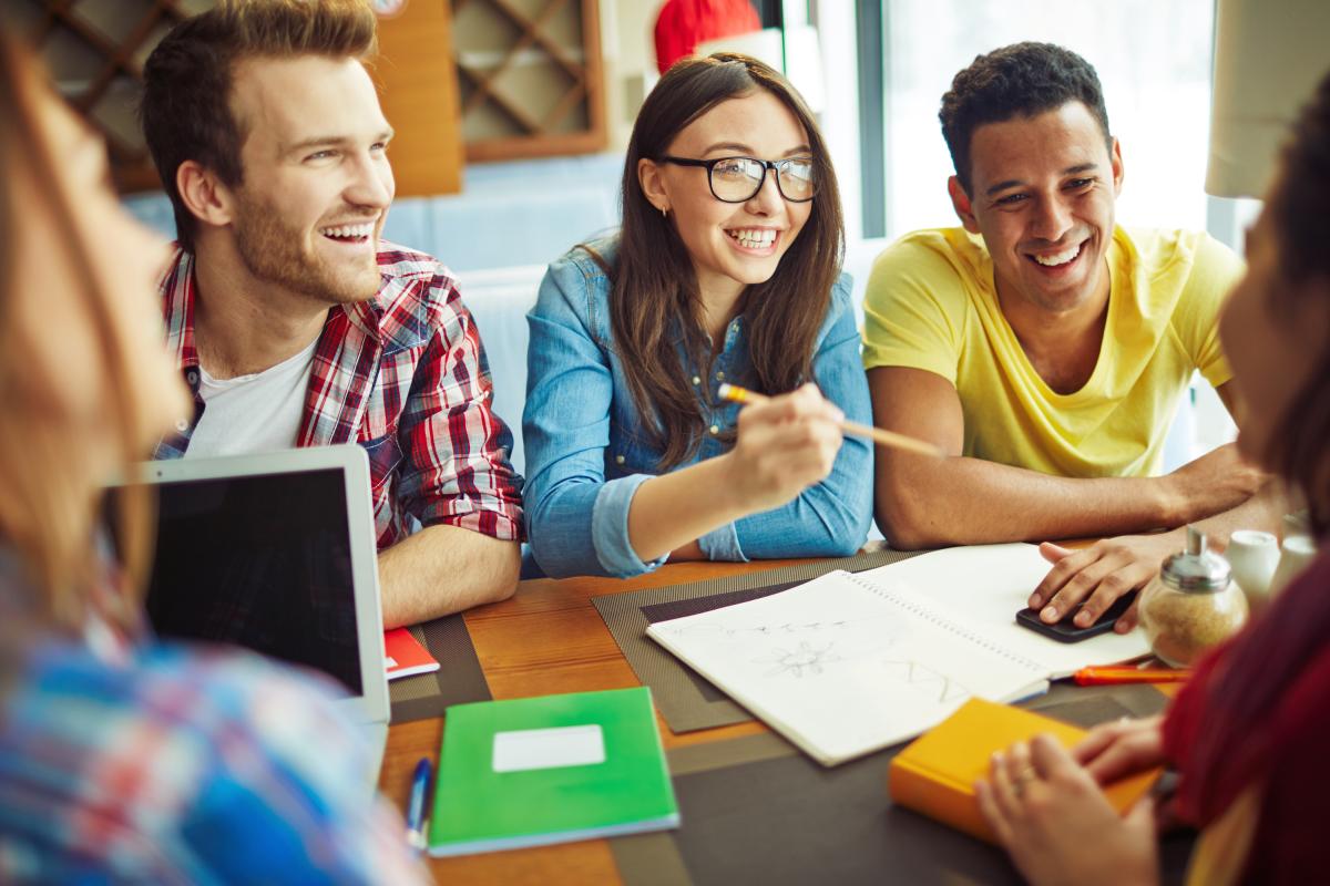 Group of teens sitting at a table