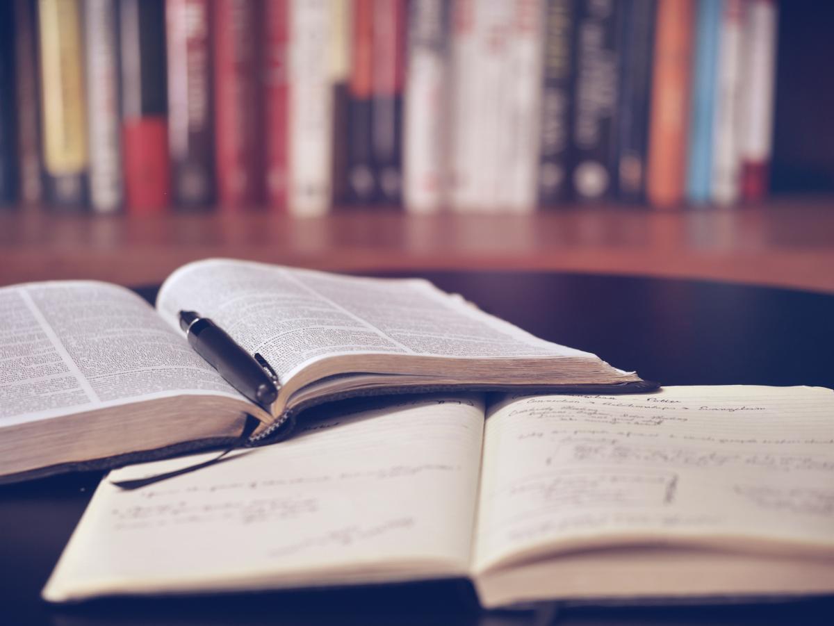 Two open books on a table.