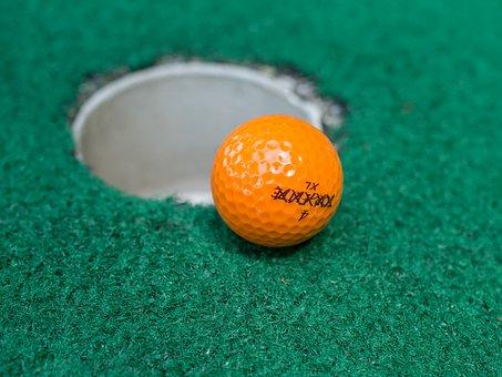 Golf ball near hole