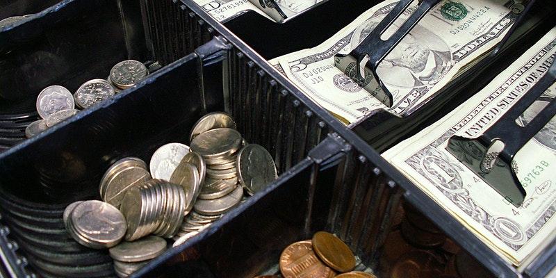 Cash register drawer full of money