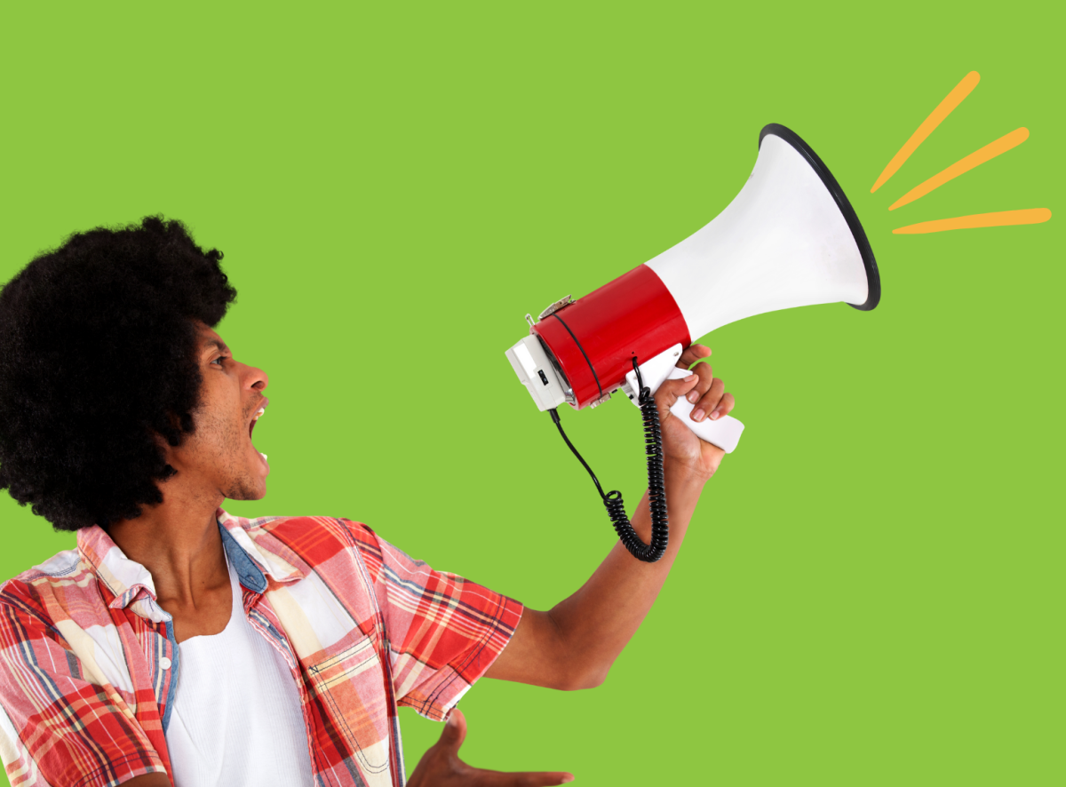 A young man shouting into a megaphone.