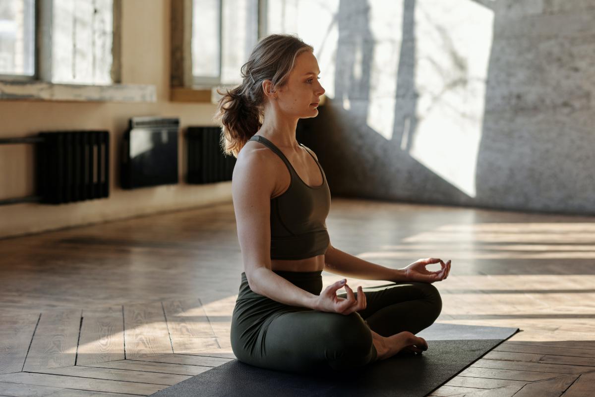 Woman sitting in yoga pose