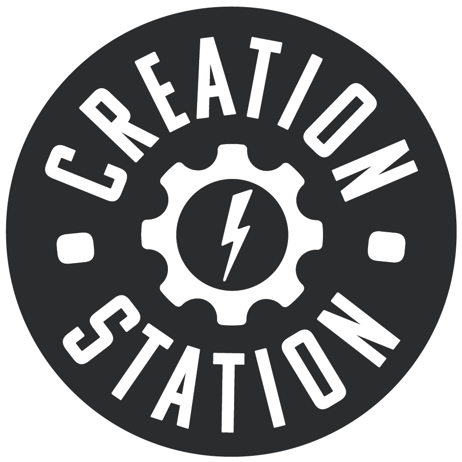 Black and white Creation Station round logo with a gear symbol containing a firebolt in the center