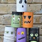 Painted cans with Halloween designs - ghost, Frankenstein, mummy, pumpkin and black cat.