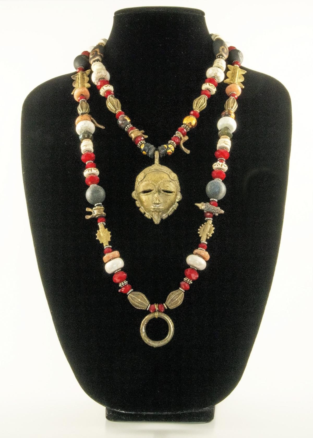 Handmade necklace on a black bust form