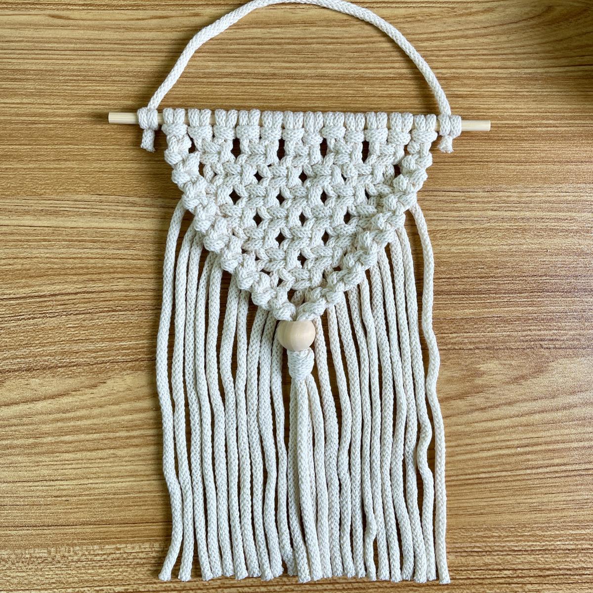 An image of a macrame wall hanging as an example of the project that will be made for this program