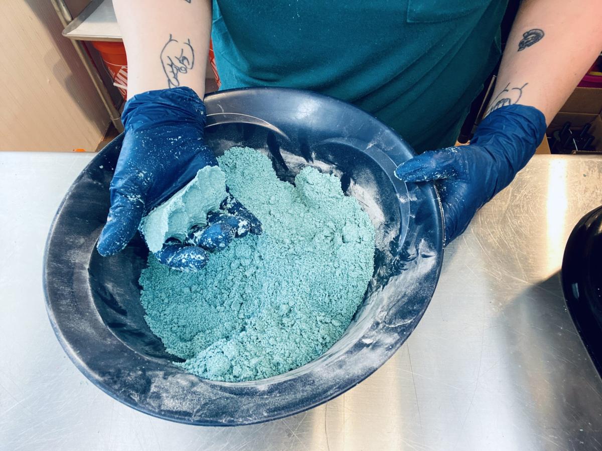 Hands grabbing Soap powder