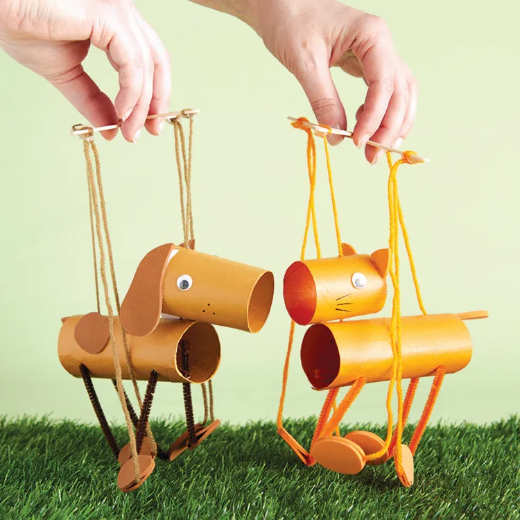 Marionette puppets made from cardboard tubes and yarn.