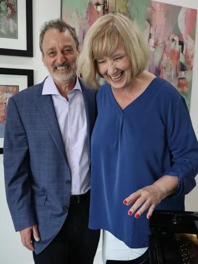 Photo of pianist Alan Wasserman and artist Midge Johnson.